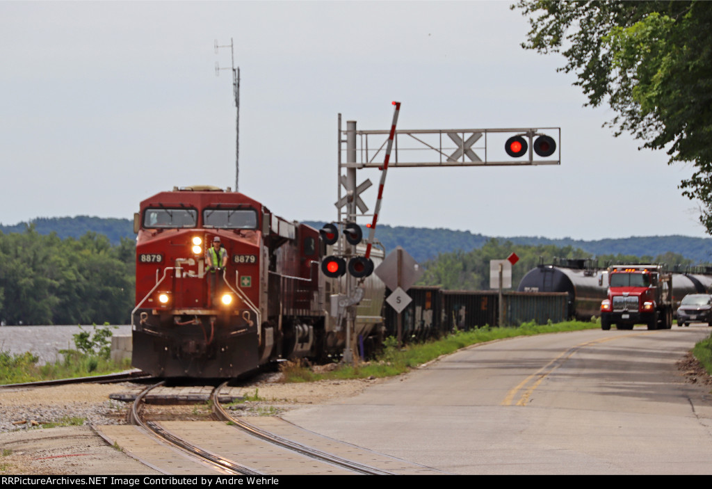 CPKC K51, Dubuque-Marquette turn, hangs a left at the wye to cross Great River Rd. and enter the yard